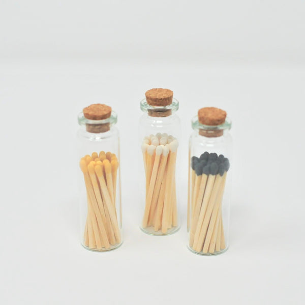 matches in a glass vial with cork top